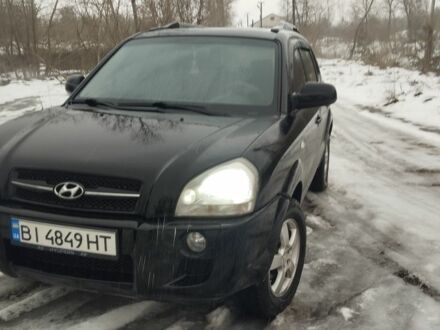 Черный Хендай Туксон, объемом двигателя 2 л и пробегом 255 тыс. км за 8300 $, фото 1 на Automoto.ua