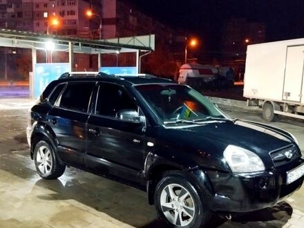 Черный Хендай Туксон, объемом двигателя 2 л и пробегом 230 тыс. км за 8600 $, фото 1 на Automoto.ua