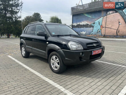 Черный Хендай Туксон, объемом двигателя 2 л и пробегом 255 тыс. км за 7250 $, фото 1 на Automoto.ua