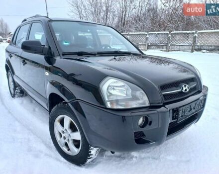 Черный Хендай Туксон, объемом двигателя 1.98 л и пробегом 240 тыс. км за 8550 $, фото 1 на Automoto.ua