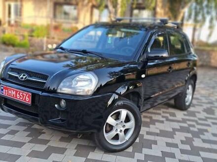 Чорний Хендай Туксон, об'ємом двигуна 2 л та пробігом 190 тис. км за 8199 $, фото 1 на Automoto.ua