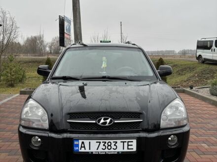 Черный Хендай Туксон, объемом двигателя 2 л и пробегом 225 тыс. км за 8600 $, фото 1 на Automoto.ua