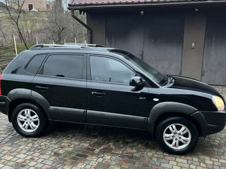 Черный Хендай Туксон, объемом двигателя 1.98 л и пробегом 175 тыс. км за 7977 $, фото 1 на Automoto.ua