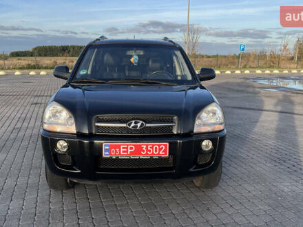 Черный Хендай Туксон, объемом двигателя 1.98 л и пробегом 243 тыс. км за 8500 $, фото 1 на Automoto.ua