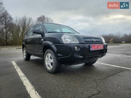Черный Хендай Туксон, объемом двигателя 1.98 л и пробегом 240 тыс. км за 7690 $, фото 1 на Automoto.ua