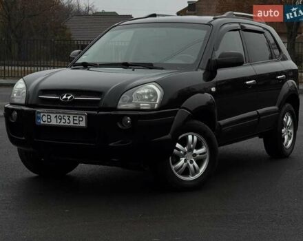 Черный Хендай Туксон, объемом двигателя 1.98 л и пробегом 217 тыс. км за 7950 $, фото 1 на Automoto.ua