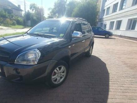 Черный Хендай Туксон, объемом двигателя 2 л и пробегом 203 тыс. км за 7600 $, фото 1 на Automoto.ua