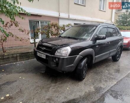 Черный Хендай Туксон, объемом двигателя 1.98 л и пробегом 234 тыс. км за 7800 $, фото 1 на Automoto.ua