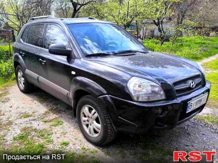 Черный Хендай Туксон, объемом двигателя 2 л и пробегом 261 тыс. км за 7500 $, фото 1 на Automoto.ua