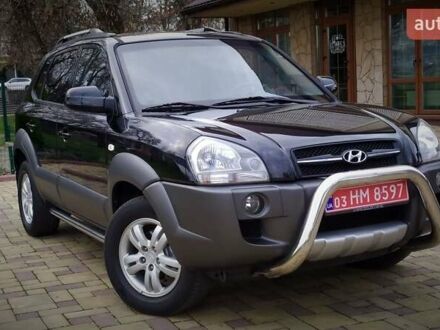 Черный Хендай Туксон, объемом двигателя 2 л и пробегом 229 тыс. км за 8600 $, фото 1 на Automoto.ua