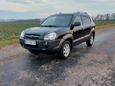 Черный Хендай Туксон, объемом двигателя 2 л и пробегом 272 тыс. км за 7500 $, фото 1 на Automoto.ua