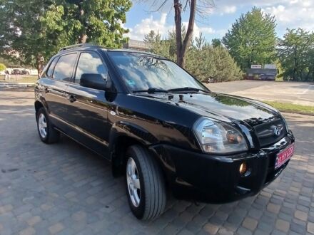 Черный Хендай Туксон, объемом двигателя 2 л и пробегом 260 тыс. км за 6800 $, фото 1 на Automoto.ua