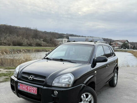 Черный Хендай Туксон, объемом двигателя 1.98 л и пробегом 159 тыс. км за 7600 $, фото 1 на Automoto.ua