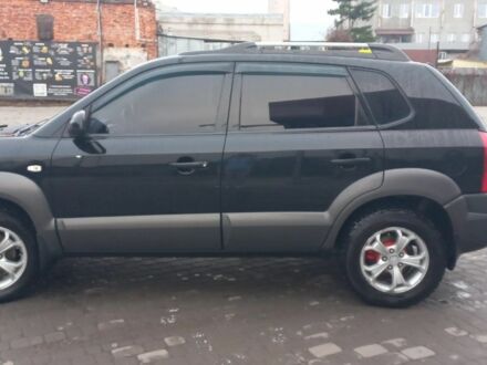Черный Хендай Туксон, объемом двигателя 2 л и пробегом 200 тыс. км за 8300 $, фото 1 на Automoto.ua