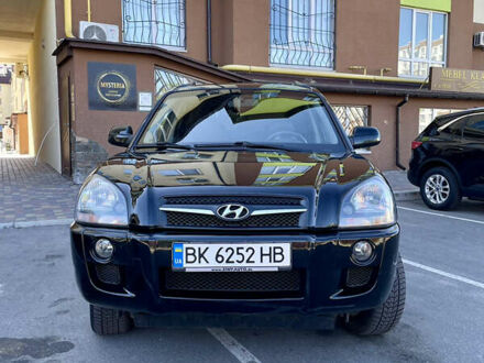 Черный Хендай Туксон, объемом двигателя 1.98 л и пробегом 217 тыс. км за 7750 $, фото 1 на Automoto.ua