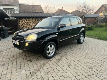 Черный Хендай Туксон, объемом двигателя 2 л и пробегом 276 тыс. км за 6950 $, фото 1 на Automoto.ua