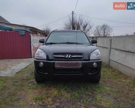 Черный Хендай Туксон, объемом двигателя 2 л и пробегом 237 тыс. км за 7500 $, фото 1 на Automoto.ua