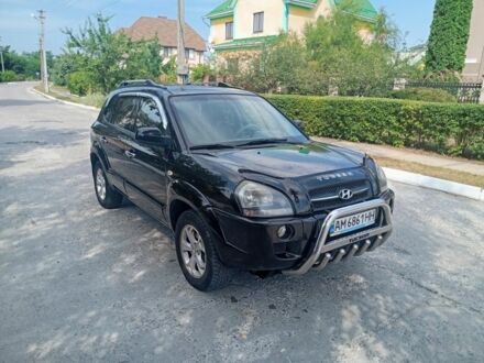 Черный Хендай Туксон, объемом двигателя 2 л и пробегом 260 тыс. км за 6750 $, фото 1 на Automoto.ua