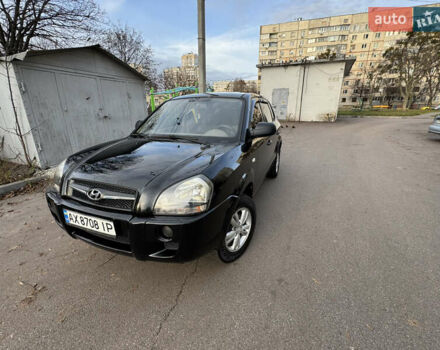 Черный Хендай Туксон, объемом двигателя 1.98 л и пробегом 196 тыс. км за 7999 $, фото 1 на Automoto.ua