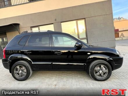 Черный Хендай Туксон, объемом двигателя 2 л и пробегом 170 тыс. км за 8700 $, фото 1 на Automoto.ua