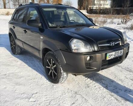 Черный Хендай Туксон, объемом двигателя 1.98 л и пробегом 185 тыс. км за 7800 $, фото 1 на Automoto.ua