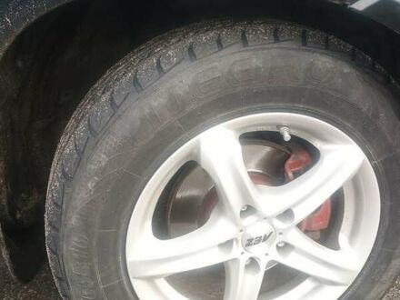 Черный Хендай Туксон, объемом двигателя 1.98 л и пробегом 283 тыс. км за 8800 $, фото 1 на Automoto.ua