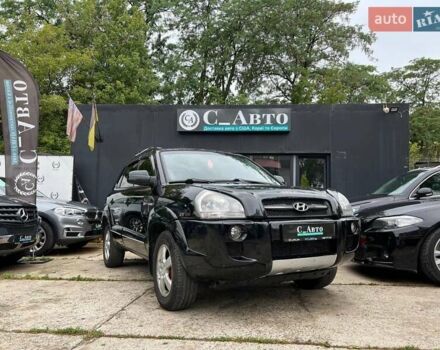 Черный Хендай Туксон, объемом двигателя 2 л и пробегом 200 тыс. км за 7300 $, фото 1 на Automoto.ua