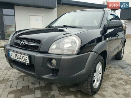Черный Хендай Туксон, объемом двигателя 2 л и пробегом 225 тыс. км за 8000 $, фото 1 на Automoto.ua