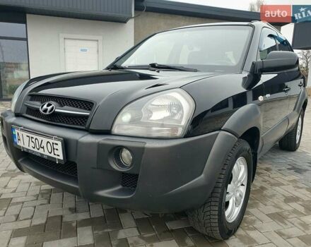 Черный Хендай Туксон, объемом двигателя 2 л и пробегом 225 тыс. км за 8000 $, фото 1 на Automoto.ua