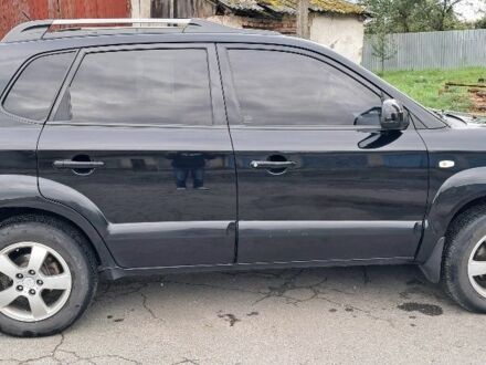 Черный Хендай Туксон, объемом двигателя 2 л и пробегом 270 тыс. км за 8300 $, фото 1 на Automoto.ua