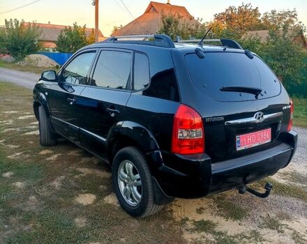 Черный Хендай Туксон, объемом двигателя 2 л и пробегом 175 тыс. км за 8300 $, фото 1 на Automoto.ua