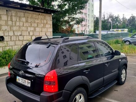 Черный Хендай Туксон, объемом двигателя 2 л и пробегом 152 тыс. км за 7800 $, фото 1 на Automoto.ua