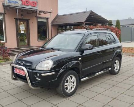 Черный Хендай Туксон, объемом двигателя 1.98 л и пробегом 214 тыс. км за 7700 $, фото 1 на Automoto.ua