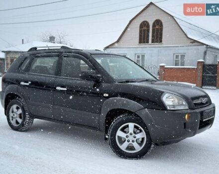 Черный Хендай Туксон, объемом двигателя 1.98 л и пробегом 175 тыс. км за 7700 $, фото 1 на Automoto.ua