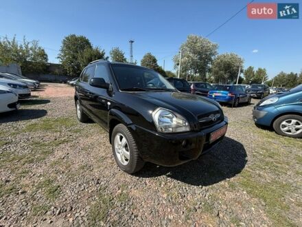 Черный Хендай Туксон, объемом двигателя 2 л и пробегом 225 тыс. км за 8200 $, фото 1 на Automoto.ua