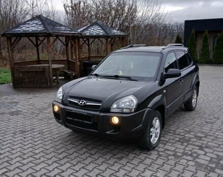 Черный Хендай Туксон, объемом двигателя 2 л и пробегом 230 тыс. км за 8000 $, фото 1 на Automoto.ua