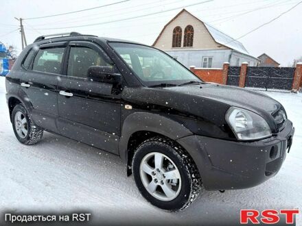 Черный Хендай Туксон, объемом двигателя 2 л и пробегом 175 тыс. км за 7699 $, фото 1 на Automoto.ua