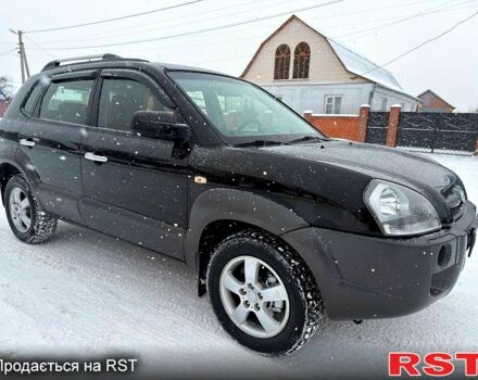 Черный Хендай Туксон, объемом двигателя 2 л и пробегом 175 тыс. км за 7699 $, фото 1 на Automoto.ua