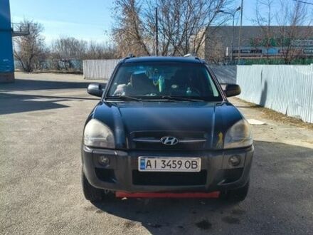 Черный Хендай Туксон, объемом двигателя 2 л и пробегом 280 тыс. км за 6200 $, фото 1 на Automoto.ua