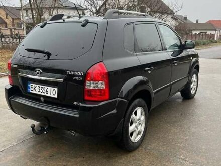 Черный Хендай Туксон, объемом двигателя 2 л и пробегом 128 тыс. км за 9200 $, фото 1 на Automoto.ua