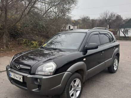 Черный Хендай Туксон, объемом двигателя 2 л и пробегом 120 тыс. км за 9000 $, фото 1 на Automoto.ua