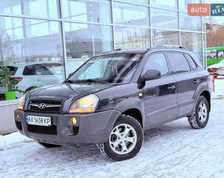 Черный Хендай Туксон, объемом двигателя 1.98 л и пробегом 225 тыс. км за 7350 $, фото 1 на Automoto.ua