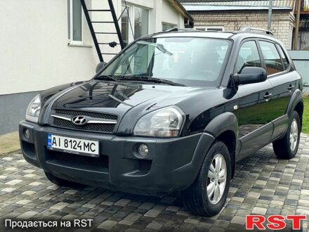 Черный Хендай Туксон, объемом двигателя 2 л и пробегом 200 тыс. км за 8499 $, фото 1 на Automoto.ua