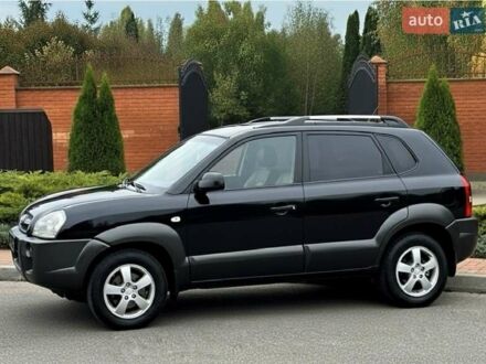 Черный Хендай Туксон, объемом двигателя 2 л и пробегом 91 тыс. км за 11400 $, фото 1 на Automoto.ua