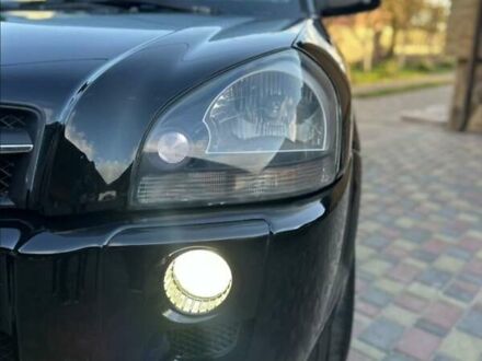 Черный Хендай Туксон, объемом двигателя 1.98 л и пробегом 198 тыс. км за 8250 $, фото 1 на Automoto.ua