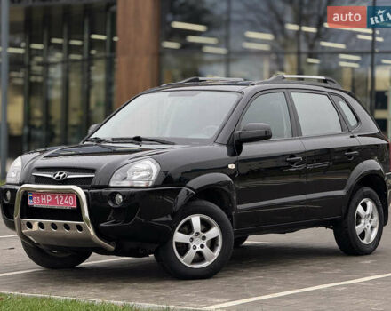 Черный Хендай Туксон, объемом двигателя 1.98 л и пробегом 202 тыс. км за 7650 $, фото 1 на Automoto.ua