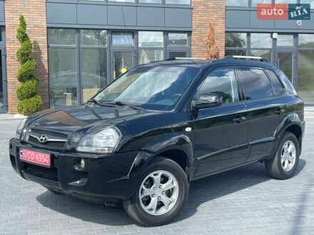 Черный Хендай Туксон, объемом двигателя 2 л и пробегом 210 тыс. км за 9750 $, фото 1 на Automoto.ua