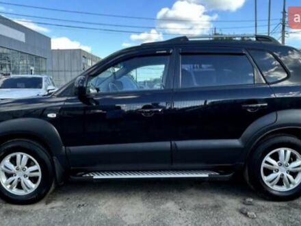 Черный Хендай Туксон, объемом двигателя 1.98 л и пробегом 186 тыс. км за 9500 $, фото 1 на Automoto.ua