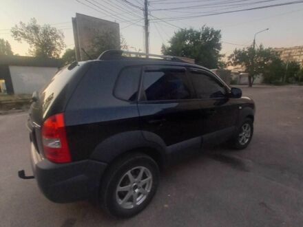 Черный Хендай Туксон, объемом двигателя 2 л и пробегом 290 тыс. км за 8500 $, фото 1 на Automoto.ua