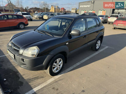 Черный Хендай Туксон, объемом двигателя 1.98 л и пробегом 218 тыс. км за 9350 $, фото 1 на Automoto.ua